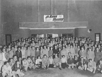 The many people who participated in its dedication and grand opening pose on stairs at entrance to The LAST RESORT.