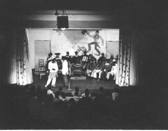 'Welcome Artillery' says the sign at rear of the stage.